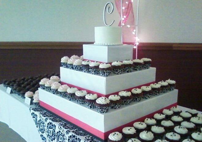 wedding cakes with multiple layers with cupcakes