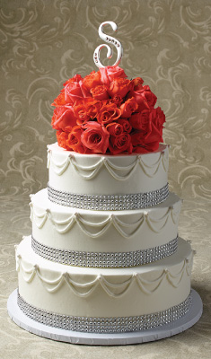 3 tier wedding cake with floral design on top
