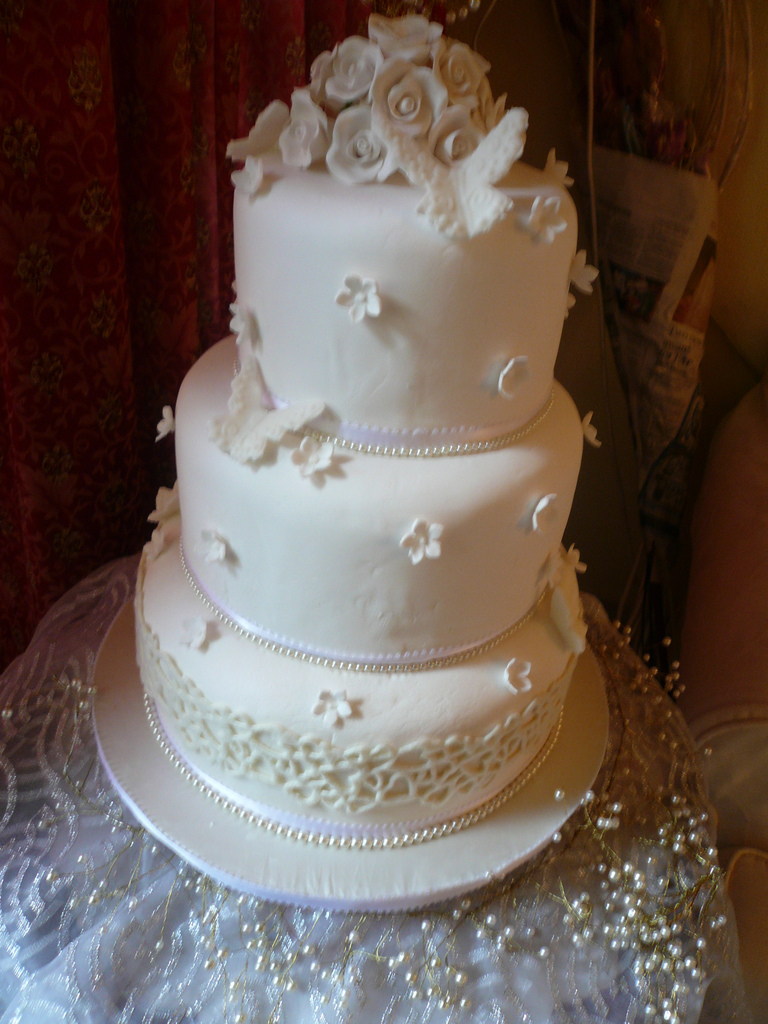 wedding cake decorated with fondant and roses