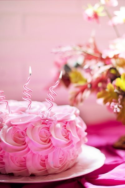 Gorgeous Pink Cake with three candles