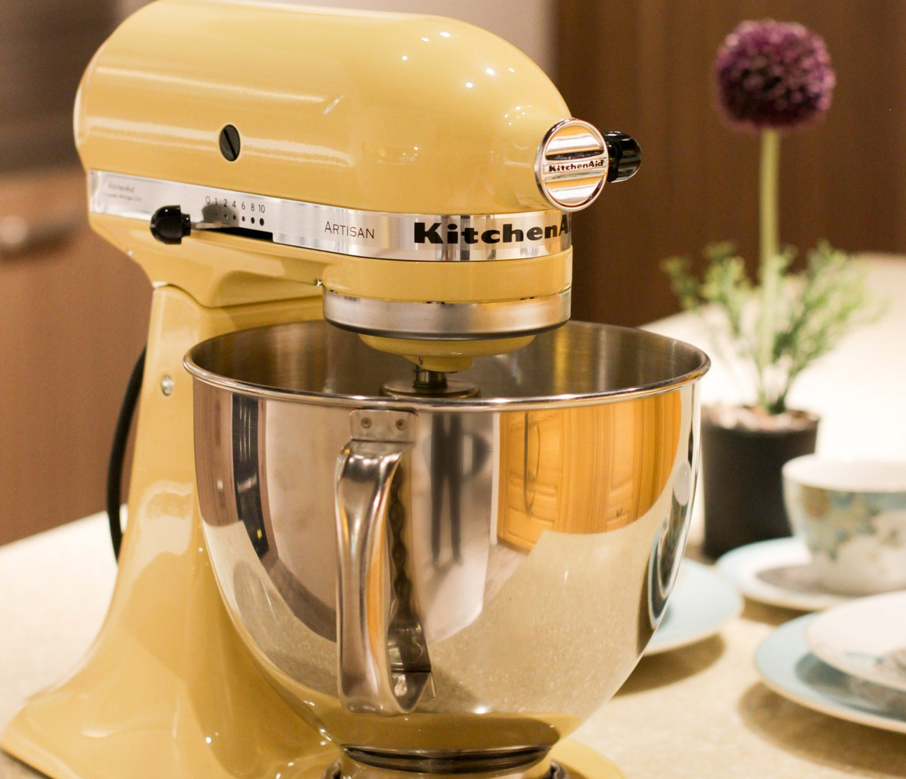 yellow kitchenaid stand mixer on the table